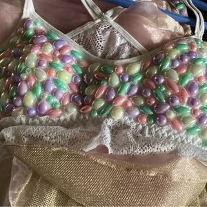 Costume , long half skirt , and matching bra .